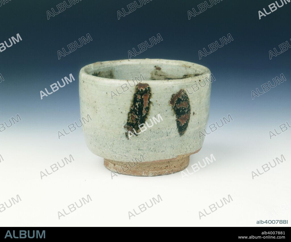 Grey glazed cup with brown splashes, Yuan dynasty, China, 1279-1368. A small straight-sided cup with straight foot with thick grey glaze and iron brown splashes. The coarse body is of Fujian type.