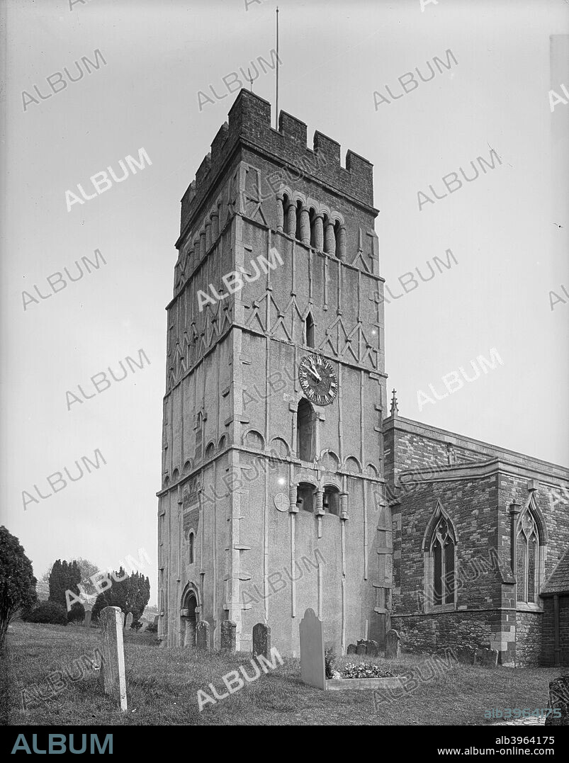 Earls Barton church, Northamptonshire. The tower of All Saints' church, Earls Barton, is a magnificent example of Saxon work. Note the long-and-short work at the corners, the pilaster strips, the windows with turned balusters, and the doorway in the west wall. The rest of the church is of a later date.