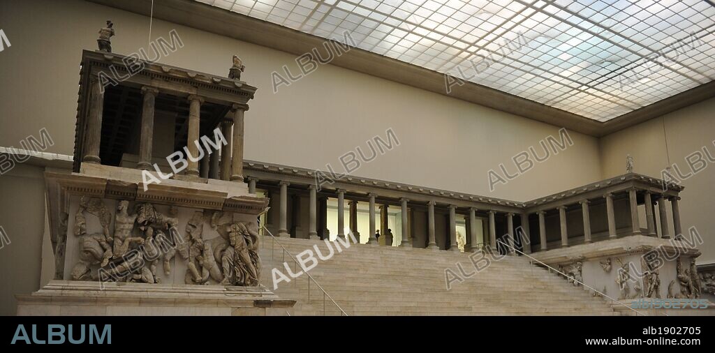 Pergamon Altar. Built by order of Eumenes II Soter. 164-156 BC by artists of the school of Pergamon. Marble and limestone. First, Gigantomachy, West frieze. Left to right: Amphitrite and his son Triton fighting the giants. Pergamon Museum. Berlin. Germany.