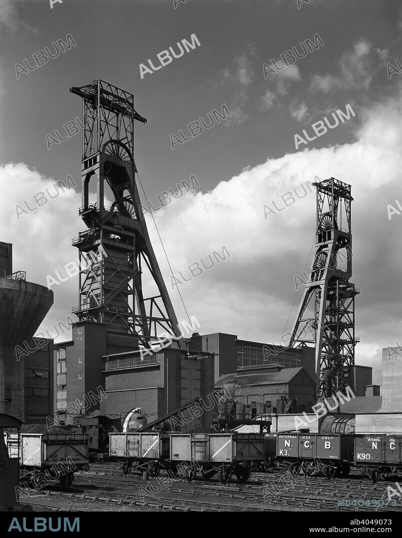 The headgear at Clipstone Colliery, Nottinghamshire, 1963. The original shafts of Clipstone Colliery in Mansfield were sunk in 1922 to give access to the top hard seam. In the 1950s the shafts were deepened to their current 920m depth to provide access to other seams. After its closure by British Coal in 1993, the colliery was reopened under the control of RJB Mining in April 1994 until it again ceased operations in 2003 after producing a further four million tonnes of coal.