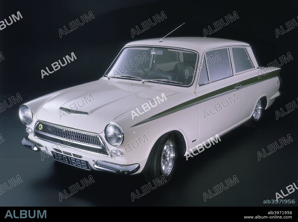 1964 Ford Lotus Cortina MK1.The Lotus Cortina first appeared in 1963, and was the fruit of a collaboration between Ford (UK) and Lotus Cars. A stiffened two door Cortina body was fitted with a Lotus 1558cc, twin-cam engine providing 105bhp and capable of reaching a top speed of 108mph. Wide road wheels and tyres provided plenty of grip, and the car featured white paintwork with a distinctive green flash.