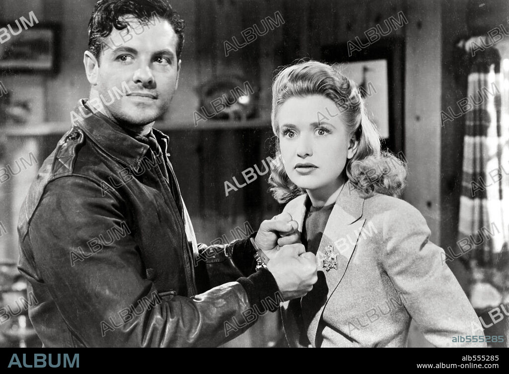 PRISCILLA LANE and ROBERT CUMMINGS in SABOTEUR, 1942, directed by ALFRED HITCHCOCK. Copyright UNIVERSAL PICTURES.
