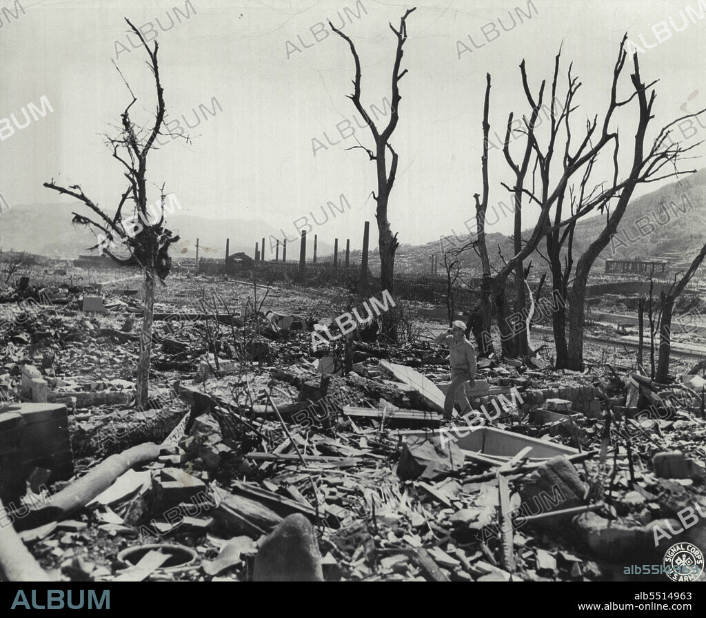 Top: Fat Man - the Plutonium-core atomic bomb which was exploded over Nagasaki. Above: The tortured remains of trees and rubble after the blast. October 09, 1945. (Photo by US Signal Corps Photo).