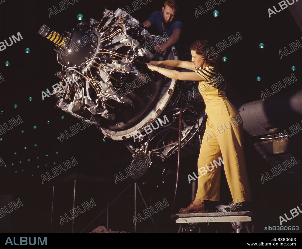 ALFRED T PALMER. Women are trained to do precise and vital engine installation detail in Douglas Aircraft Company plants, Long Beach, Calif.