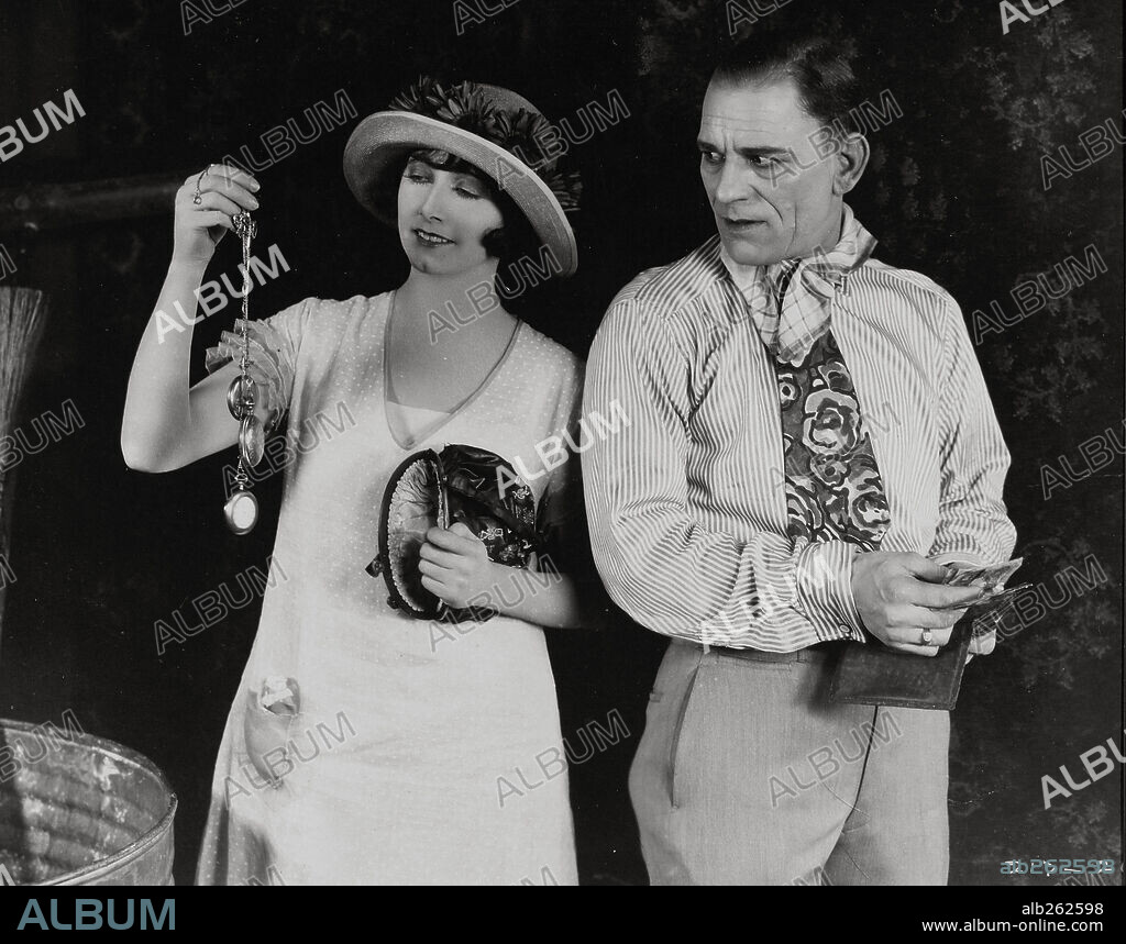 LON CHANEY and MAE BUSCH in THE UNHOLY THREE, 1925, directed by TOD BROWNING. Copyright M.G.M.