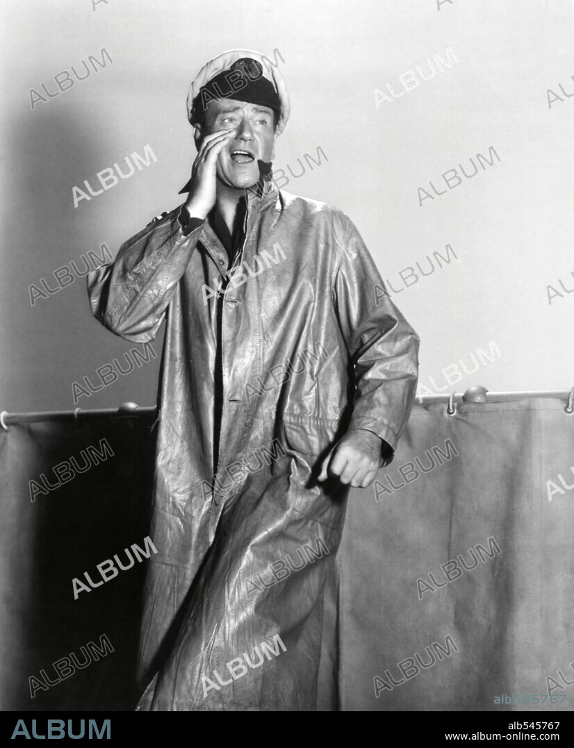 JOHN WAYNE in THE SEA CHASE, 1955, directed by JOHN FARROW. Copyright WARNER BROTHERS.