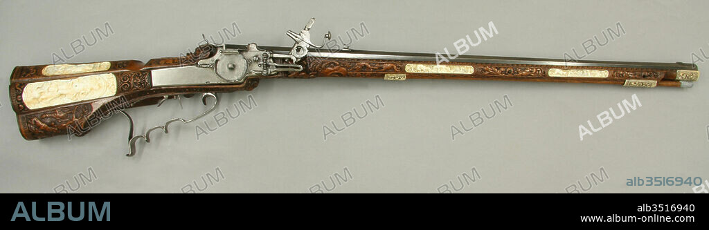 Wheellock Rifle Made for Emperor Leopold I, ca. 1685, Schwäbisch Gmünd, German, Schwäbisch Gmünd, Steel, pearwood, ivory, mother-of-pearl, L. 43 1/2 in. (110.5 cm); L. of barrel 30 1/4 in. (76.8 cm); Cal. .50 in. (12.7 mm); L. of lock 8 1/16 in. (20.5 cm); L. of stock 43 9/16 in. (110.6 cm); Wt. 8 lb. 10 oz. (3912 g), Firearms-Guns-Wheellock, One of Maucher's greatest masterpieces, the stock is delicately worked in low relief and decorated with inset panels of ivory. The largest panel, on the lid of the patchbox, depicts the goddess Fortuna or the Birth of Venus.