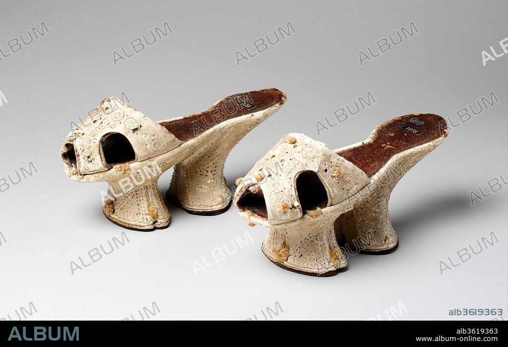 Chopines. Culture: Italian. Date: ca. 1600.
The high platform shoes known as chopines came into fashion in Venice in the sixteenth century. Awkward yet practical, they served to keep the wearer's precariously perched feet from getting wet or soiled in the city's perpetually damp byways and also to signal her elevated social status. It was once thought that very high chopines, as much as twenty inches, were worn by courtesans to establish a highly visible public profile. Like expensive jewels and silk gowns, chopines were favored both by patrician women and the successful courtesans who contrived to emulate their appearance by donning expensive finery. Such fancy footwear does not unequivocally signal that its owner was a courtesan, but the chopines-shod woman in Pietro Bertelli's erotic flap print (55.503.30) undoubtedly represents that niche of society.