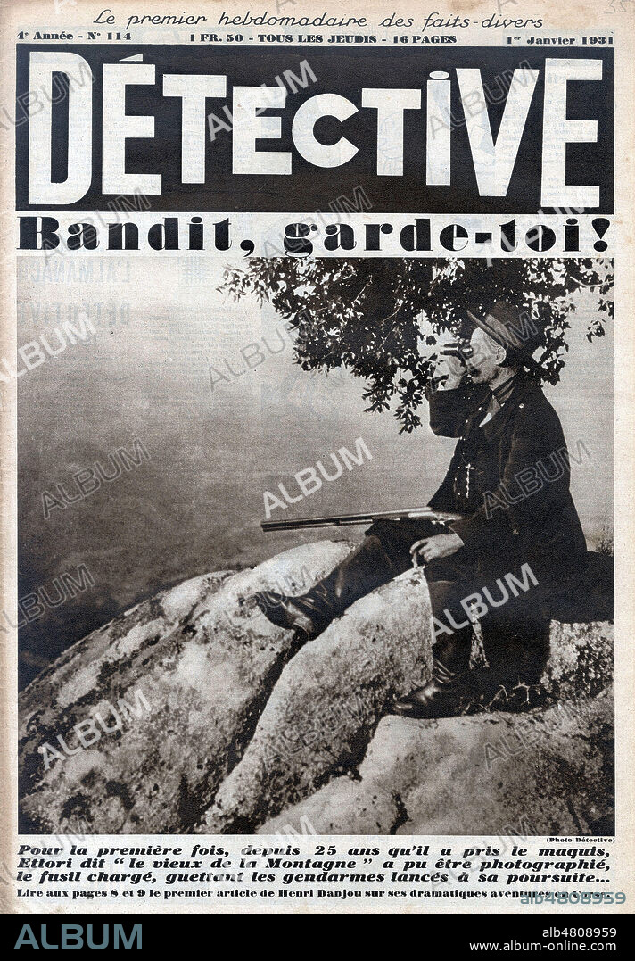 Bandits, garde-toi! Jean-Simon ETTORI (1880-1962), depuis 25 ans dans le maquis corse, guette les gendarmes lances a sa poursuite. Photographie anonyme pour Detective du 1er janvier 1931. Credit : Collection Kharbine-Tapabor.