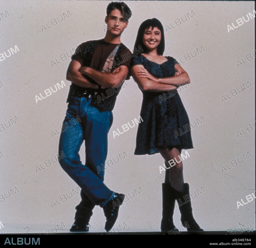 JASON PRIESTLEY and SHANNEN DOHERTY in BEVERLY HILLS,90210, 1990, directed by DANIEL ATTIAS, DAVID SEMEL, JASON PRIESTLEY and MICHAEL LANGE. Copyright FOX/BROADCASTING CO.
