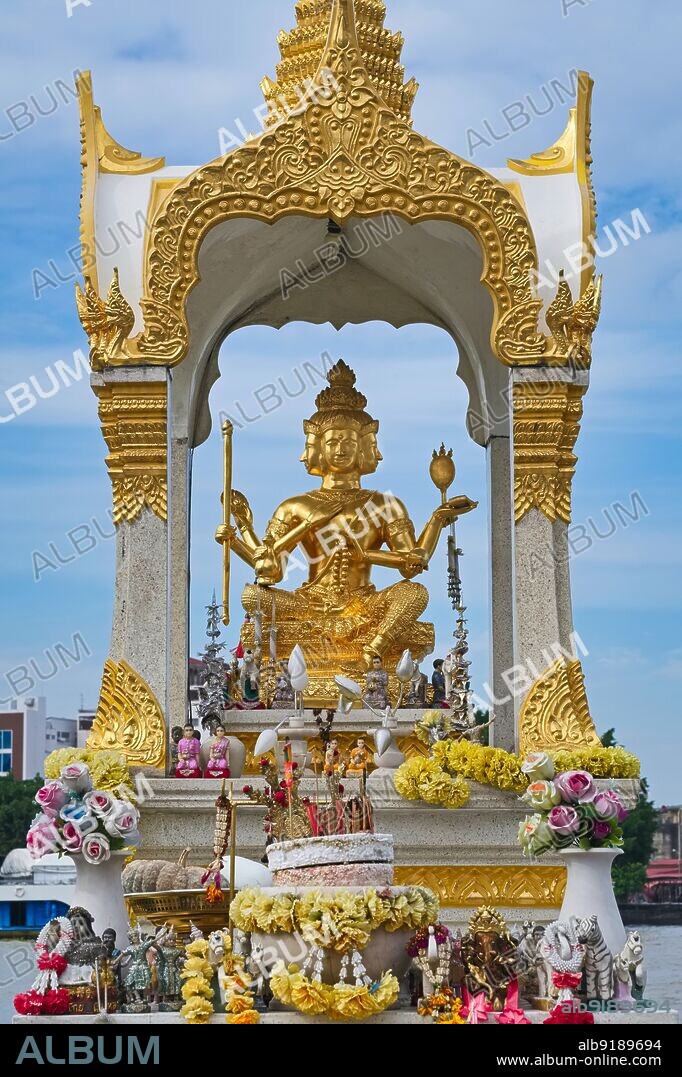 Thailand: Shrine with a four-faced figure of Hindu god Brahma by the Chao Phraya River in Chinatown, Bangkok. Brahma is the Hindu god (deva) of creation and one of the Trimurti, the others being Visnu (Vishnu) and Siva (Shiva). According to the Brahma Purana, he is the father of Manu, and from Manu all human beings are descended. In the RamayaÜa and the Mahabharata, he is often referred to as the progenitor or great grandsire of all human beings.