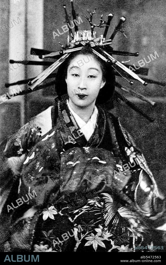 Oiran (??) were the courtesans of Edo period Japan. The oiran were considered a type of yujo (??) 'woman of pleasure' or prostitute. However, they were distinguished from the yujo in that they were entertainers, and many became celebrities of their times outside the pleasure districts. Their art and fashions often set trends among the wealthy and, because of this, cultural aspects of oiran traditions continue to be preserved to this day. The oiran arose in the Edo period (1600–1868). At this time, laws were passed restricting brothels to walled districts set some distance from the city center. In the major cities these were the Shimabara in Kyoto, the Shinmachi in Osaka, and the Yoshiwara in Edo (present-day Tokyo). These rapidly grew into large, self-contained 'pleasure quarters' offering all manner of entertainments. Within, a courtesan’s birth rank held no distinction, which was fortunate considering many of the courtesans originated as the daughters of impoverished families who were sold into this lifestyle as indentured servants. Instead, they were categorized based on their beauty, character, education, and artistic ability. Among the oiran, the tayu (??) was considered the highest rank of courtesan and were considered suitable for the daimyo or feudal lords. In the mid-1700s courtesan rankings began to disappear and courtesans of all classes were collectively known simply as 'oiran'. The word oiran comes from the Japanese phrase oira no tokoro no nesan (????????) which translates as 'my elder sister'. When written in Japanese, it consists of two kanji, ? meaning 'flower', and ? meaning 'leader' or 'first', hence 'Leading Flower' or 'First Flower'.