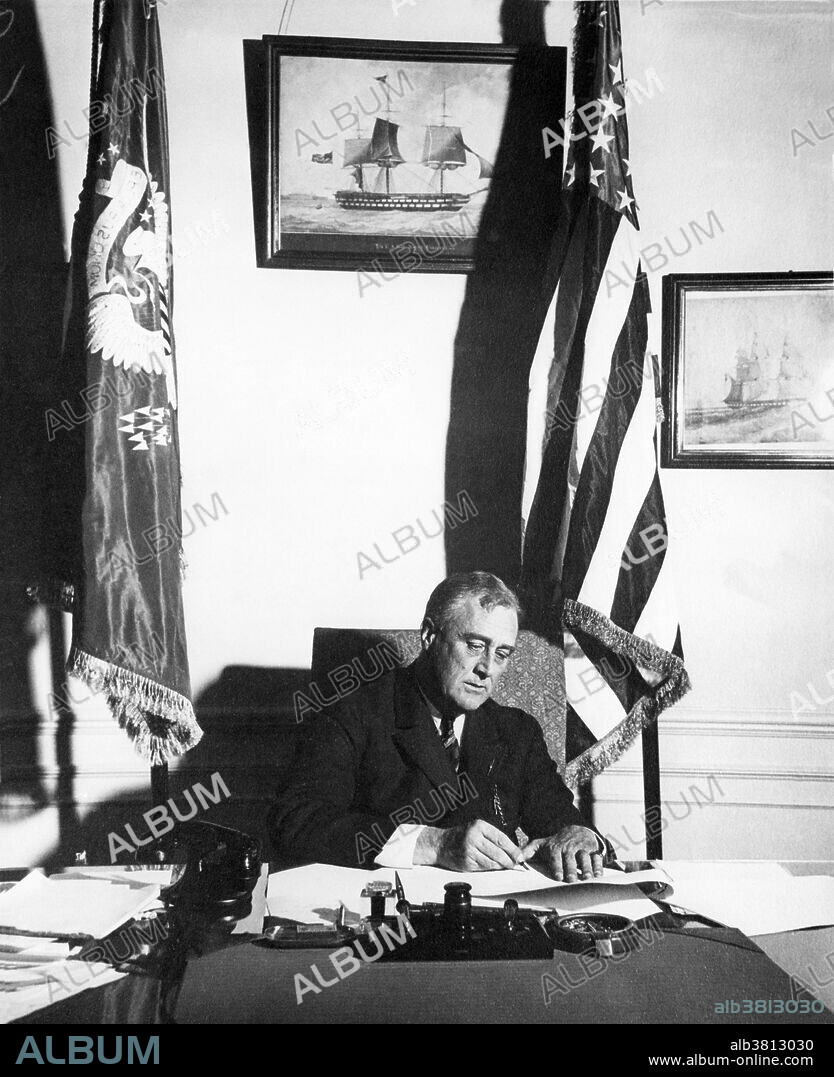 FDR signing the Emergency Banking Act of 1933. Franklin Delano Roosevelt (January 30, 1882 - April 12, 1945) was the 32nd President of the US (1933-45) and a central figure in world events during the mid-20th century, leading the US during a time of worldwide economic crisis and world war. The only American president elected to more than two terms, he facilitated a durable coalition that realigned American politics for decades. With the popular song "Happy Days Are Here Again" as his campaign theme, FDR defeated incumbent Republican Hoover in 1932, at the depth of the Great Depression. FDR's persistent optimism and activism contributed to a renewal of the national spirit, reflecting his victory over paralytic illness to become the longest serving president in US history. As an active military leader, he implemented a war strategy on two fronts that ended in the defeat of the Axis Powers, and he initiated the development of the world's first atomic bomb. He worked closely with Churchill, Stalin and Kai-shek in leading the Allies against Nazi Germany, Fascist Italy and Imperial Japan in WWII, but died just as victory was in sight. On April 12, 1945 he suffered a massive cerebral hemorrhage and died at the age of 63. His death was met with shock and grief across America and around the world.