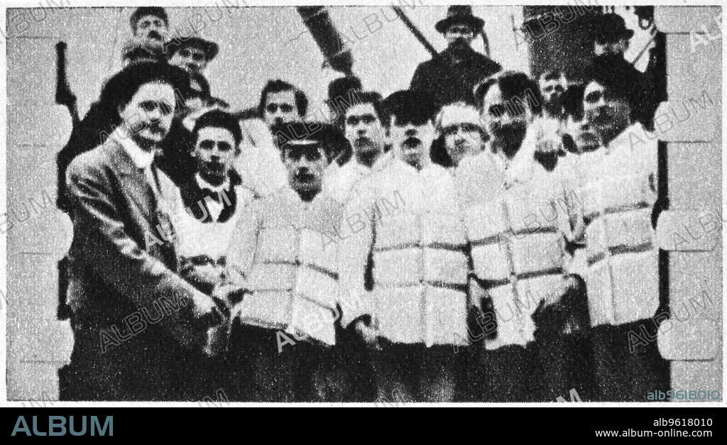 Members of the crew of the Titanic in their life jackets, 1912. Operated by the White Star Line, SS Titanic struck an iceberg in thick fog off Newfoundland on 14 April 1912. She was the largest and most luxurious ocean liner of her time, and thought to be unsinkable. In the collision five of her watertight compartments were compromised and she sank. Out of the 2228 people on board, only 705 survived. A major cause of the loss of life was the insufficient number of lifeboats she carried.