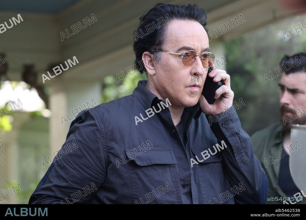 JOHN CUSACK in PURSUIT, 2022, directed by BRIAN SKIBA. Copyright ANDREW STEVENS ENTERTAINMENT INC.