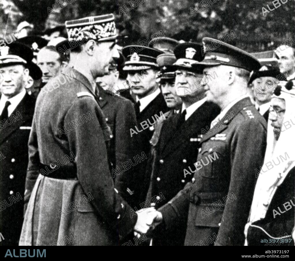 World War 2: De Gaulle greets Eisenhower, 1944. General Charles de Gaulle (1890-1970) shaking hands with General Dwight Eisenhower (1890-1969) during a meeting with allied commanders in France.