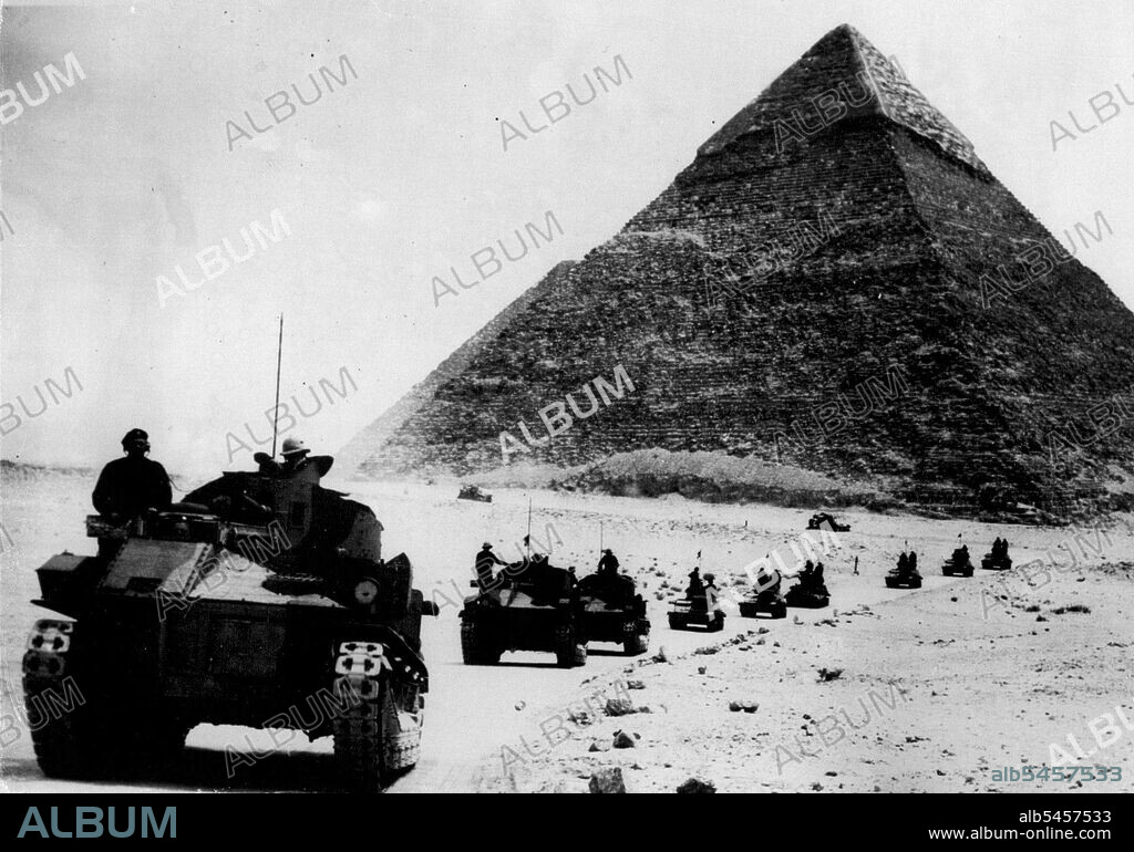 Ancient And Modern In Contrast In Egypt -- A study in ancient and modern as the tanks passed the ancient pyramids on their way to the station. 
Traffic was held up for some time in the streets of Cairo when tanks and lorries of the British Army ***** through the streets on their way to the Desert bound for Fayoum and Wadi Natrcum, to reinforce the defences. April 20, 1939. (Photo by Keystone).