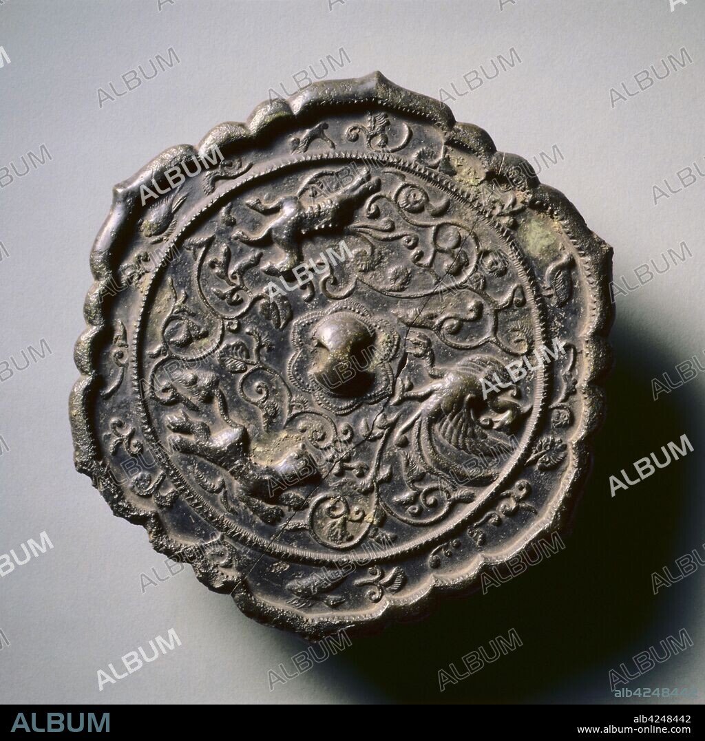 Hexafoil Mirror with Floral Interlaces, a Phoenix, and Running Animals, early 7th Century - early 10th Century. China, Tang dynasty (618-907). Bronze; diameter: 20 cm (7 7/8 in.); overall: 1 cm (3/8 in.); rim: 0.8 cm (5/16 in.).