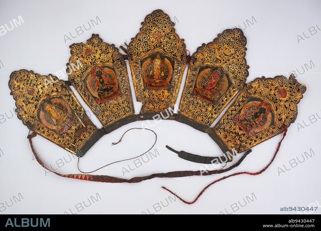 Ritual crown (diadem), 18th century, 12 x 22 in. (30.5 x 55.9 cm), Leather with polychrome lacquer, Tibet or China, 18th century, Buddhist priests and monks wear crowns, or diadems, like this during certain religious ceremonies, especially priestly initiation rites. One of the Five Cosmic Buddhas decorates each panel, which are arranged as on a mandala, or cosmic diagram. On the far left, Amoghasiddhi (green) represents north, and on the far right, Ratnasabhava (yellow) represents south. Vairochana, the white deity and principal cosmic buddha, presides over the center with a gesture of exposition. When crowned and seated in the proper direction, the priest creates and enters a living mandala.