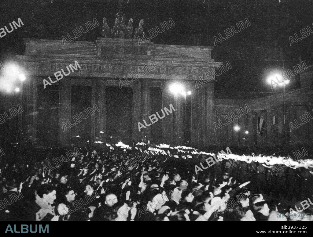 The Brandenburg Gate, Berlin, Germany, 30 January 1933. Celebrating the naming of Adolf Hitler (1889-1945) as Chancellor of Germany. From Kampf Um's Dritte Reich cigarette card album (Berlin, 1933).
