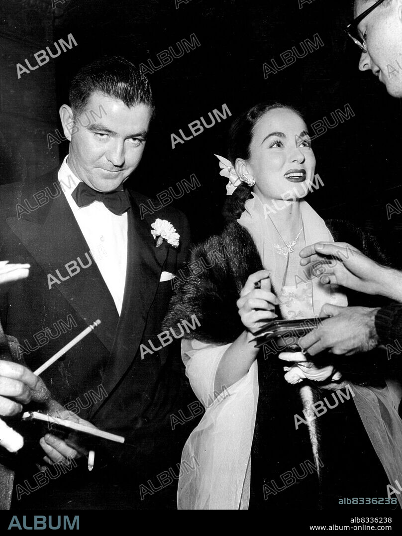 Ann Blyth attends a premiere with new fiance Dr. James McNulty. 
Ann Blyth and her husband Dr. James McNulty, Los Angeles obstetrician and brother of Dennis Day the well-known singer, at a Hollywood premiere. July 19, 1953.