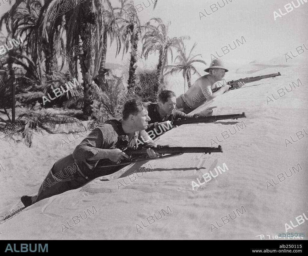 NEIL HAMILTON, VICTOR McLAGLEN and WALLACE FORD in THE LOST PATROL, 1934, directed by JOHN FORD. Copyright RKO RADIO.