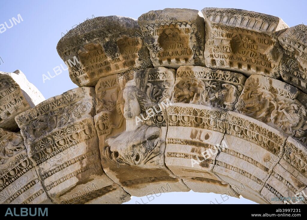 The Temple of Hadrian, Ephesus, Turkey. The Temple of Hadrian dates from the 2nd century but underwent repairs in the 4th century and has been re-erected from the surviving architectural fragments. The reliefs in the upper sections are casts, the originals being now exhibited in the Selcuk Archaeological Museum. A number of figures are depicted in the reliefs, including the emperor Theodosius I with his wife and eldest son. Ephesus was once the most important commercial centre of the ancient world and also a religious centre for early Christians. It was one of the twelve cities of the Ionian League during the Classical Greek period.