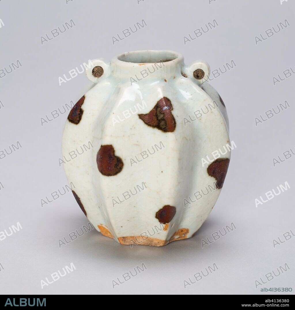Lobed Jar in Form of Balambing (Philippine Island Star Fruit). China. Date: 1300-1350. Dimensions: H. 6.9 cm (2 3/4 in.); diam. 6.5 cm (2 9/16 in.). Qingbai ware; glazed porcelain with iron spots. Origin: China.