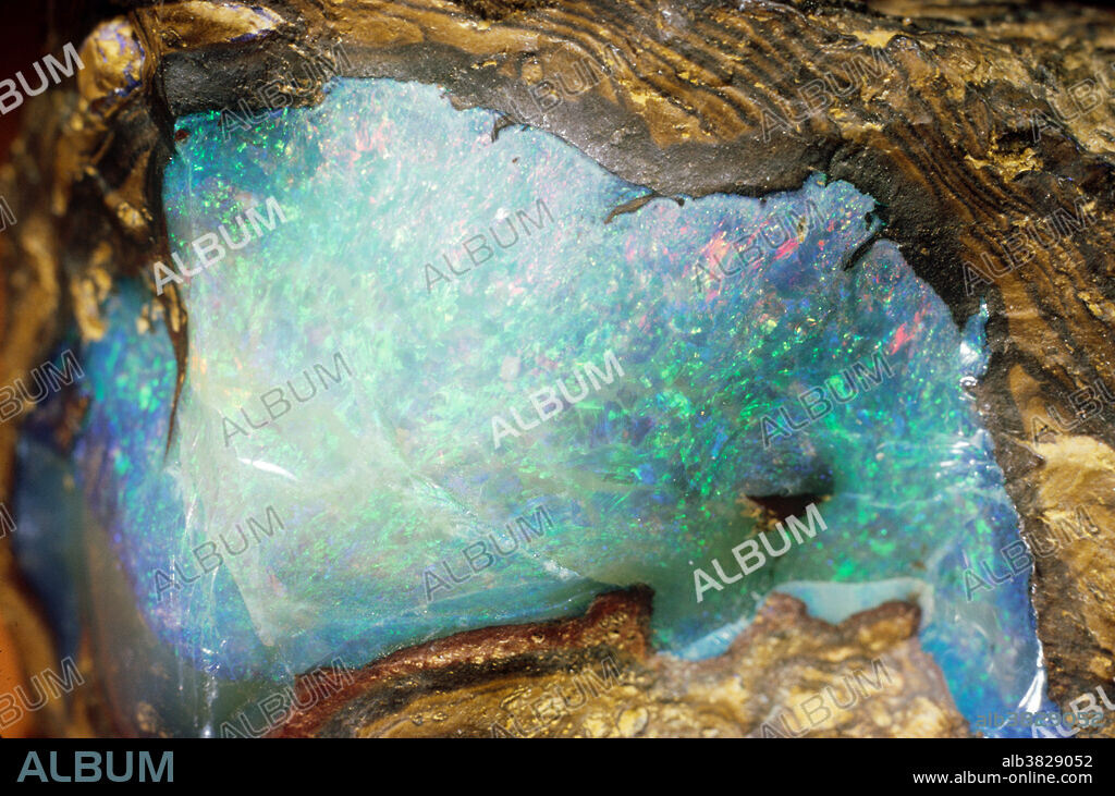 Opal is hydrated silicon oxide. Unlike quartz (silica) which is pure silicon dioxide, opal has some water in its structure, and takes the form of microscopic spherules of various sizes. When these spherules accumulate in a loose jumble the opal is nondesc.