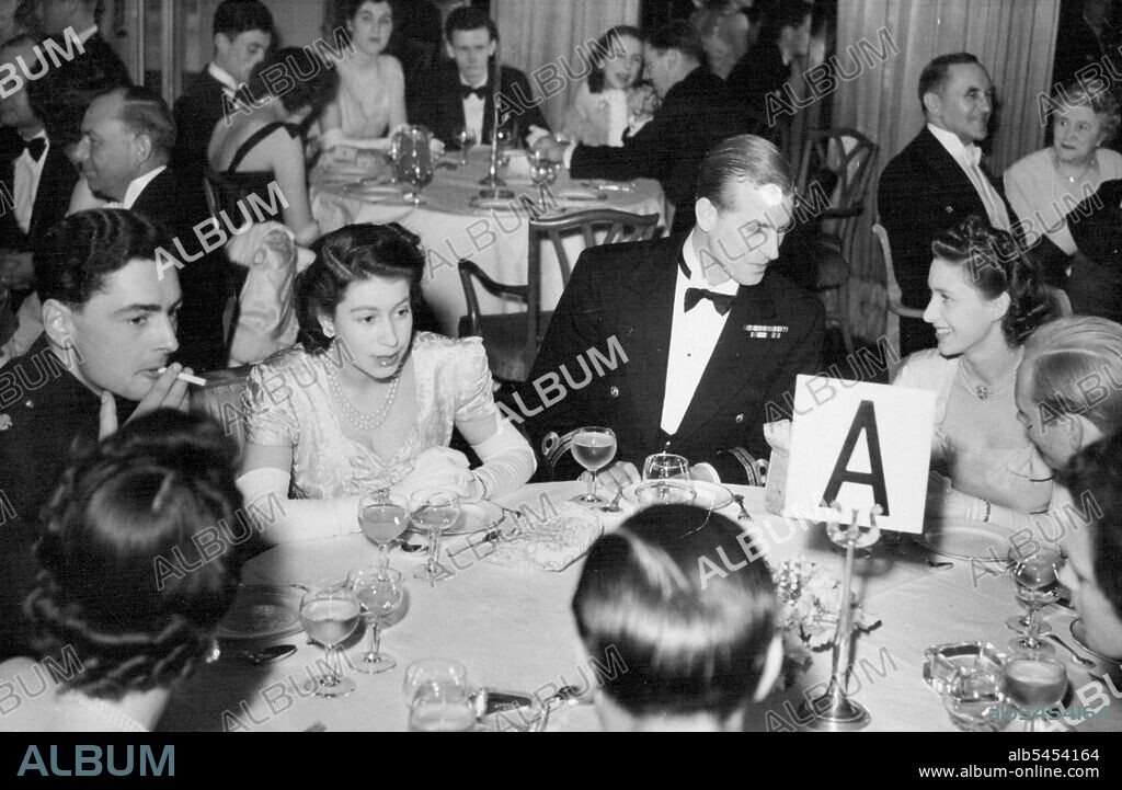 Princess At The Ball -- Left to right: Lieut. Michael Parker. R.N. : Princess Elizabeth: the Duke of Edinburgh: and Princess Margaret at supper when they attended the charity ball in aid of the King George V Sailors' Fund, at the Dorchester Hotel, London. May 05, 1948. (Photo by Sport & General Press Agency Ltd.).