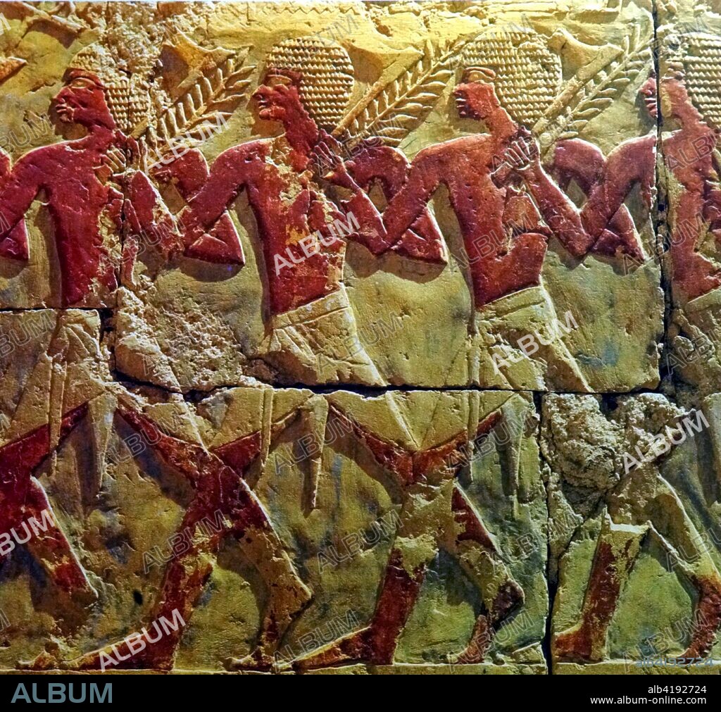 Soldiers running with axes. Wall relief from the Mortuary temple of Queen Hatshepsut at Deir el Bahri. Egypt. Queen Hatshepsut who ruled Egypt from 1479 to 1458 B.C. 18th dynasty. the New Kingdom.