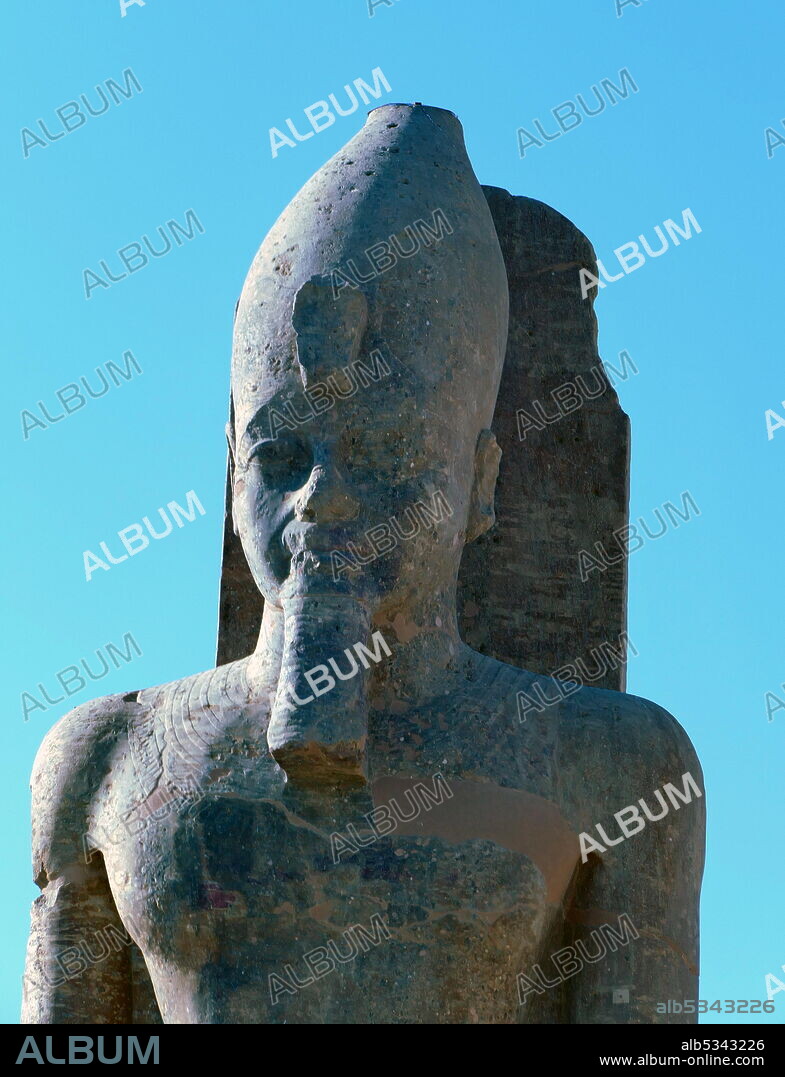 Statue of Amenhotep III at the Mortuary Temple of Amenhotep III, also known as Kom el-Hettân,  built by the architect Amenhotep, son of Habu, for the Pharaoh Amenhotep III (or Amenhetep III) during the 18th Dynasty in the New Kingdom. The mortuary temple is located on the Western bank of the Nile river, across from the Eastern bank city of Luxor..
