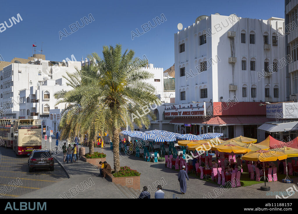 Evening view of restaurants on the Corniche at Muttrah, Muscat, Oman, Middle East.