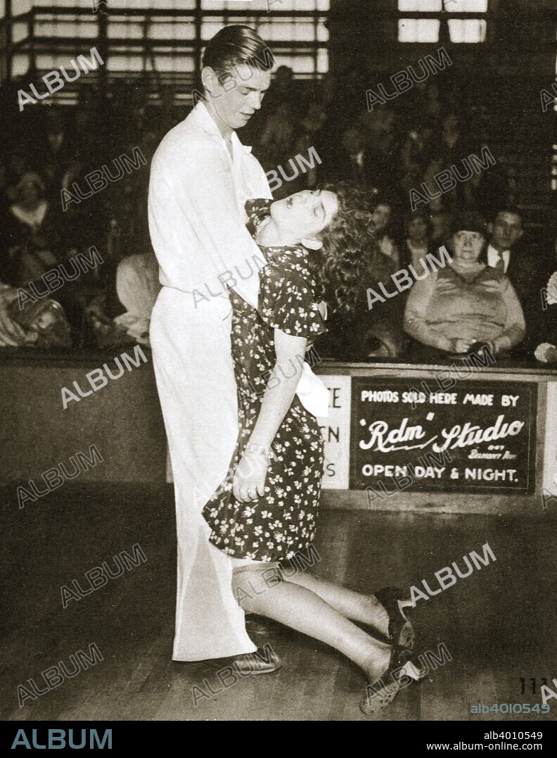 Contestants in a dance marathon, Chicago, Illinois, USA, 1930. The girl has fallen asleep. Dance marathons were popular competitions organised in the United States in the 1920s and 1930s. Contestants attempted to continue dancing for as long as posible in order to win prizes. A 1935 book about the contests, They Shoot Horses Don't They?, written by Horace McCoy, who worked as a bouncer at dance marathons, was made into a successful Academy Award-winning film in 1969.
