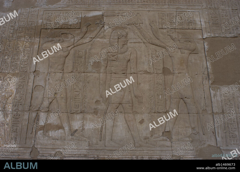 Relief depicting gods Horus and Thoth blessing a Ptolemaic pharaoh. Temple of Horus. Edfu. Egypt.
