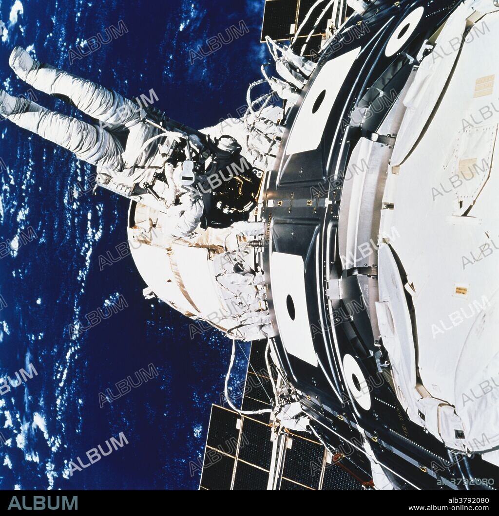 View of mission specialist James H. Newman during a spacewalk on the International Space Station, (ISS). This was during the Endeavour Space Shuttle mission STS-88, (12/4/98 - 12/15/98). He is working on the recently joined Zarya and Unity modules. These modules were the first two components of the ISS. During the mission, Zarya was captured by Endeavor's SRMS arm. Unity was then attached to Zarya.