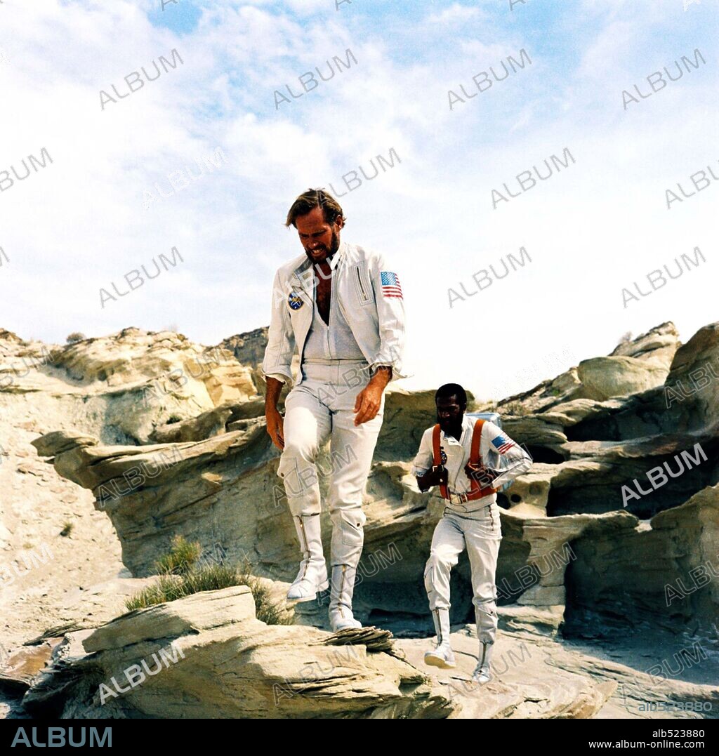 CHARLTON HESTON and JEFF BURTON in PLANET OF THE APES, 1968, directed by FRANKLIN J. SCHAFFNER. Copyright 20TH CENTURY FOX.
