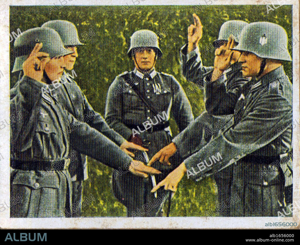 German re-armament and militarisation: German army recruits taking their oath of loyalty on the flag. From series of 270 cigarette cards 'Die Deutsche Wehrmacht', Dresden, 1936.