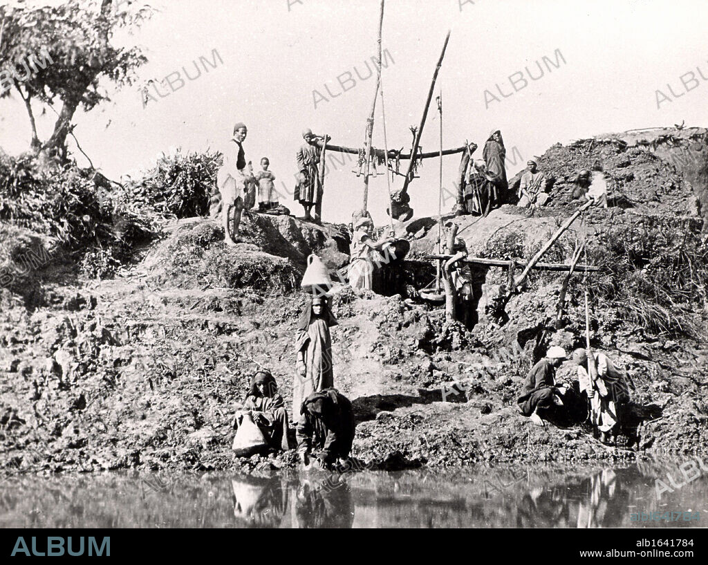 A shaduf or shadoof being used to raise water, Egypt, late 1880s. The shaduf has been used for irrigation for at least as early as 1500 BC. Photograph. Water supply. Agriculture.