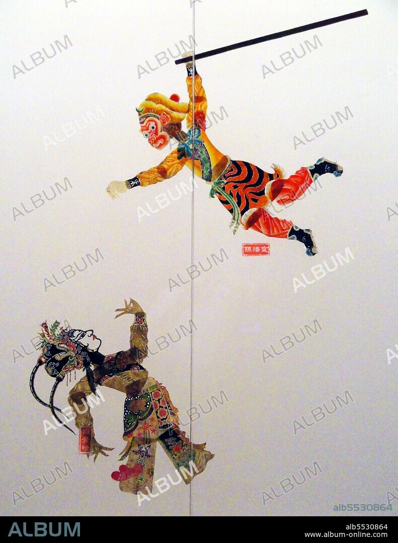 Shadow play (Chinese: ???, pí ying xì) or shadow puppetry is an ancient form of storytelling and entertainment using opaque, often articulated figures in front of an illuminated backdrop to create the illusion of moving images. It is popular in various cultures. At present, more than 20 countries are known to have shadow show troupes. Shadow puppetry originated during the Han Dynasty when one of the concubines of Emperor Wu of Han died from an illness. The emperor was devastated, and he summoned his court officers to bring his beloved back to life. The officers made a shape of the concubine using donkey leather. Her joints were animated using 11 separate pieces of the leather, and adorned with painted clothes. Using an oil lamp they made her shadow move, bringing her back to life. Shadow theatre became quite popular as early as the Song Dynasty when holidays were marked by the presentation of many shadow plays. During the Ming Dynasty there were 40 to 50 shadow show troupes in the city of Beijing alone. In the 13th century, the shadow show became a regular recreation in the barracks of the Mongolian troops. It was spread by the conquering Mongols to distant countries like Persia, Arabia, and Turkey. Later, it was introduced to other Southeastern Asian countries. The earliest shadow theatre screens were made of mulberry paper. The storytellers generally used the art to tell events between various war kingdoms or stories of Buddhist sources. Today, puppets made of leather and moved on sticks are used to tell dramatic versions of traditional fairy tales and myths. In Gansu province, it is accompanied by Daoqing music, while in Jilin, accompanying Huanglong music forms some of the basis of modern opera.