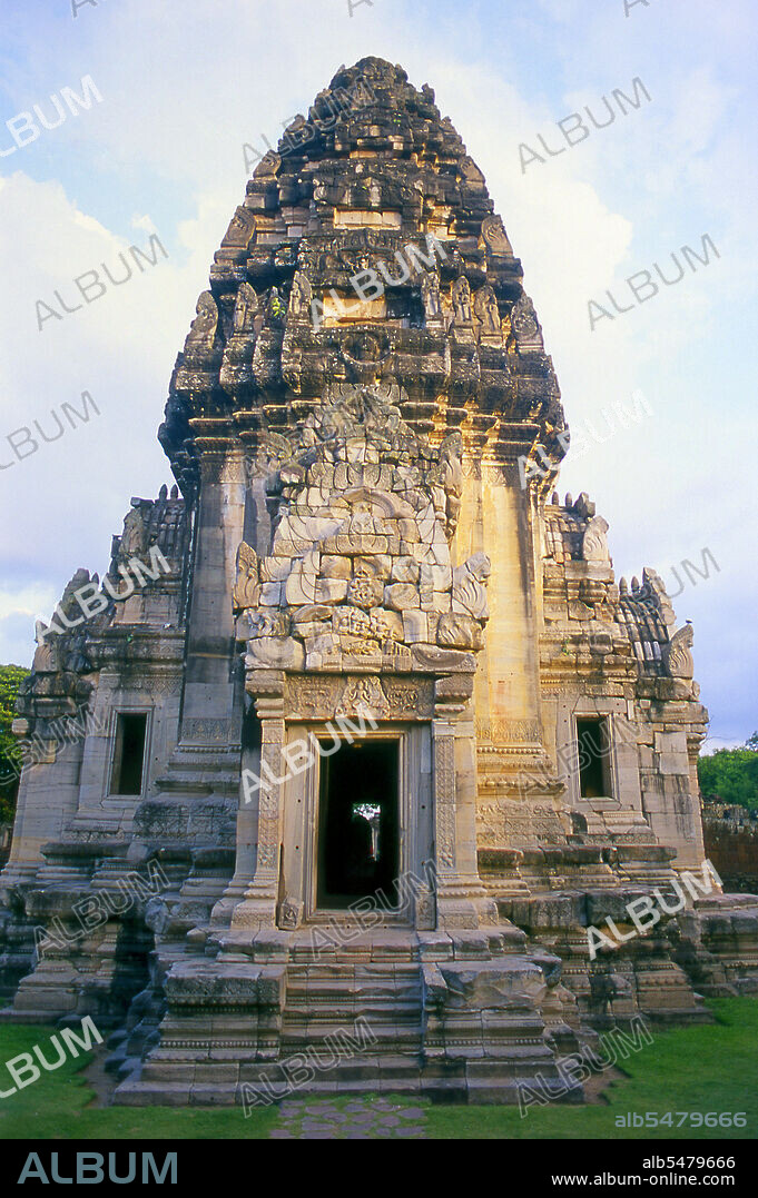 The complex at Phimai dates originally from the reign of Surayavarman II (r. 1113 - 1150), during the first part of the 12th century CE. The temple was constructed with white, finely-grained sandstone, in the same style as Angkor Wat. Like Angkor, too, Phimai was first dedicated to the cult of Vishnu. The central sanctuary tower and much of the immediate surrounding which survive today date from this early period. About one hundred years later, when Jayavarman VII (r. 1181 - 1218), 'the builder', extended and developed Phimai, the temple became a Mahayana Buddhist centre, dedicated to the Vimaya Buddha. The name 'Phimai' is derived from this. The basic structure of Jayavarman's city is readily identifiable today. The complex sits in a large rectangle which once contained a small town, and was surrounded on all four sides by water - the Mun River to the north, a natural canal to the west, and two man-made canals to the south and east. The south wall of the city was pierced by the Pratu Chai, or 'Victory Gate'. From this gateway a road led straight to Angkor, the Khmer capital.