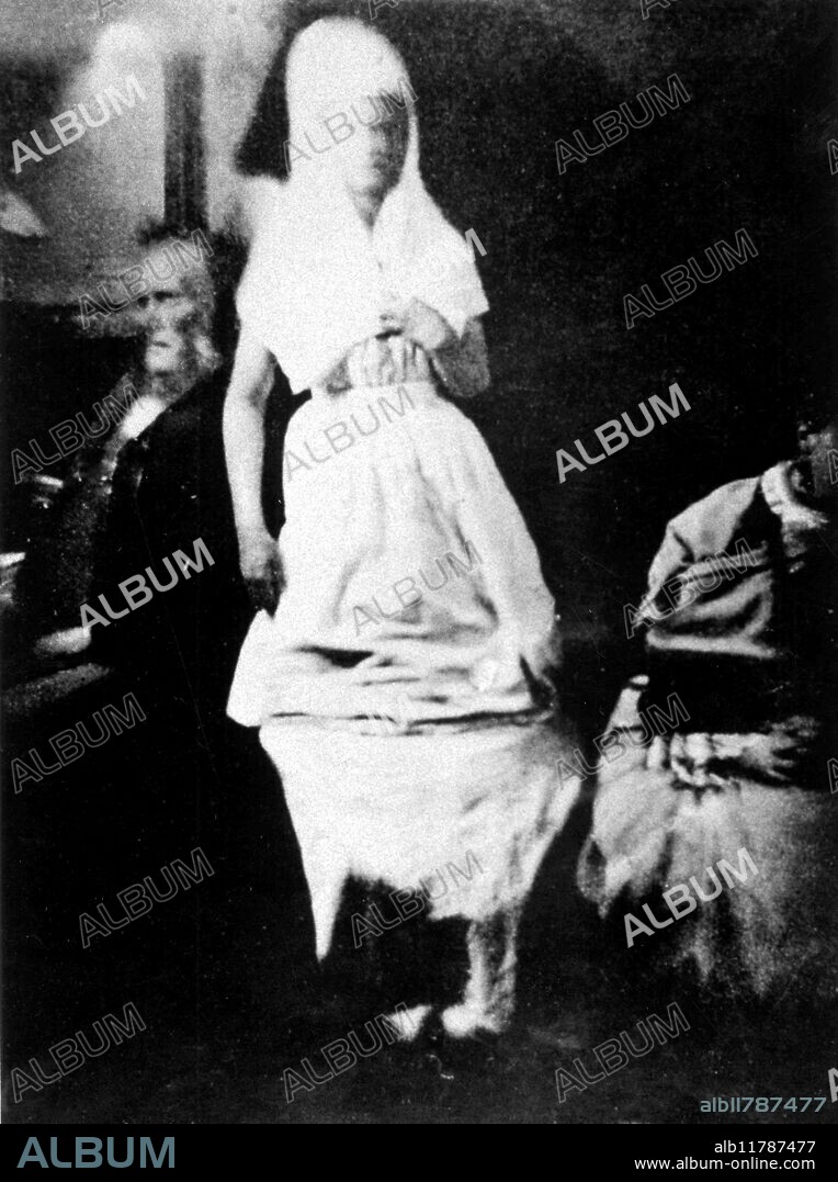 Materialised spirit Katie King who appeared at seances of medium Florence Cook; Sir William Crookes investigated and saw both medium and spirit together. Photograph probably taken 1874.