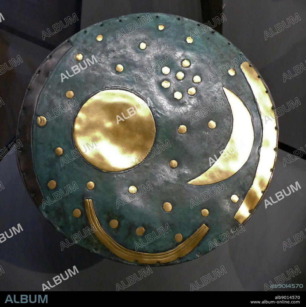 The Nebra sky disk is a bronze disk of around 30 centimetres (12 in) diameter, with a blue-green patina and inlaid with gold symbols. These are interpreted generally as a sun or full moon, a lunar crescent, and stars. Two golden arcs along the sides, marking the angle between the solstices, were added later. The disk is attributed to a site near Nebra, Saxony-Anhalt, in Germany, and associatively dated to c. 1600 BC. It has been associated with the Bronze Age Unetice culture.
