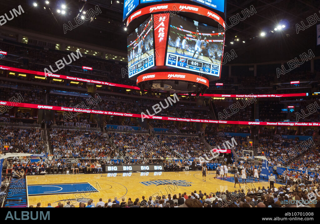 NBA new Amway Arena in Orlando Florida with big scoreboard and Orlando Magic and OK Thunder and sold out crowd with Dwight Howard on screen.