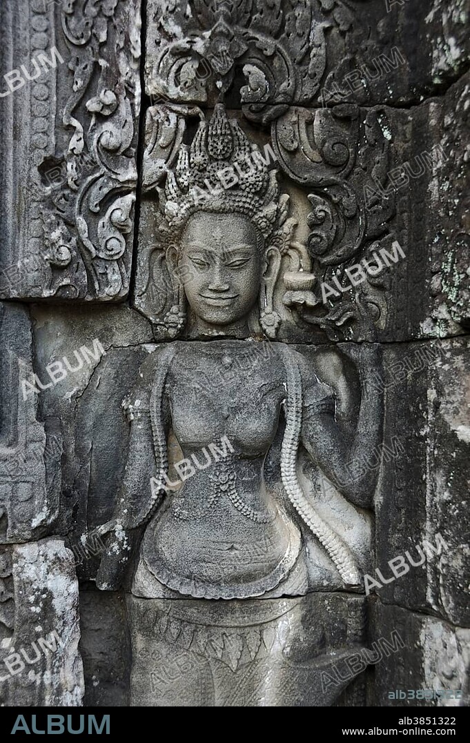 Stone carving of a female face, Apsara, celestial nymphs, Bayon Temple, Angkor Wat, Siem Reap, Cambodia, Asia.