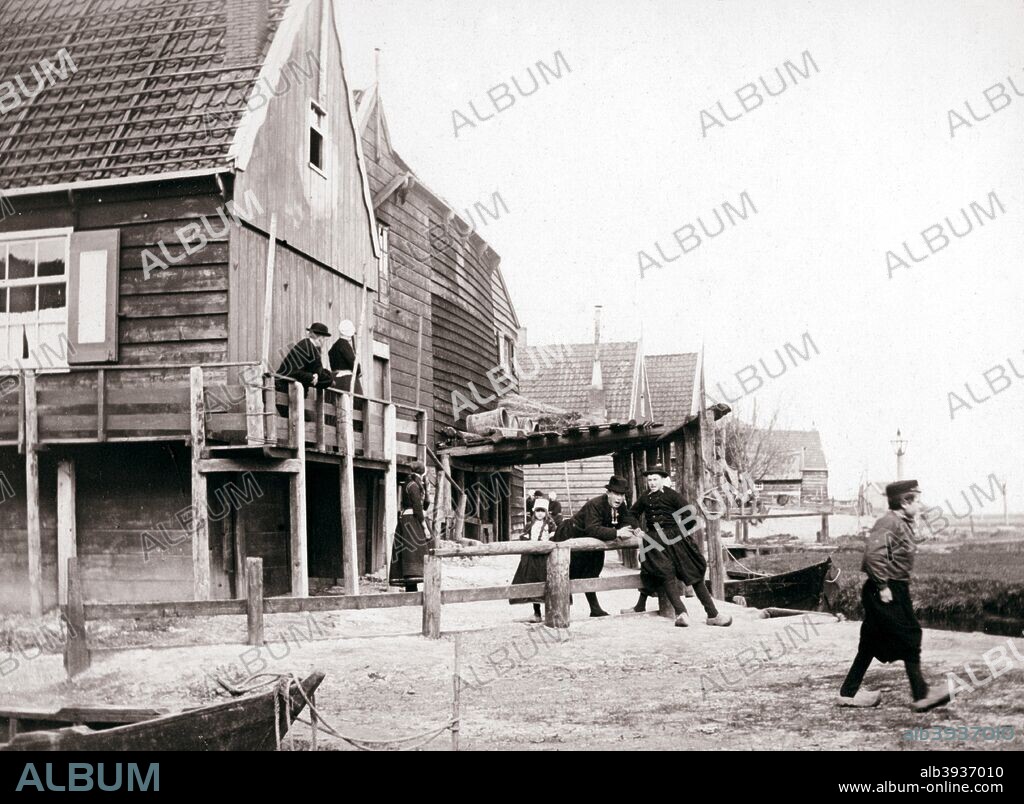 Marken Island, Netherlands, 1898. The former island of Marken is a peninsula, now connected to the North Holland mainland by a causeway. It is well-known for its characteristic wooden houses. Illustration from a book of photographs taken in Holland and Belgium by James Batkin, (1898).