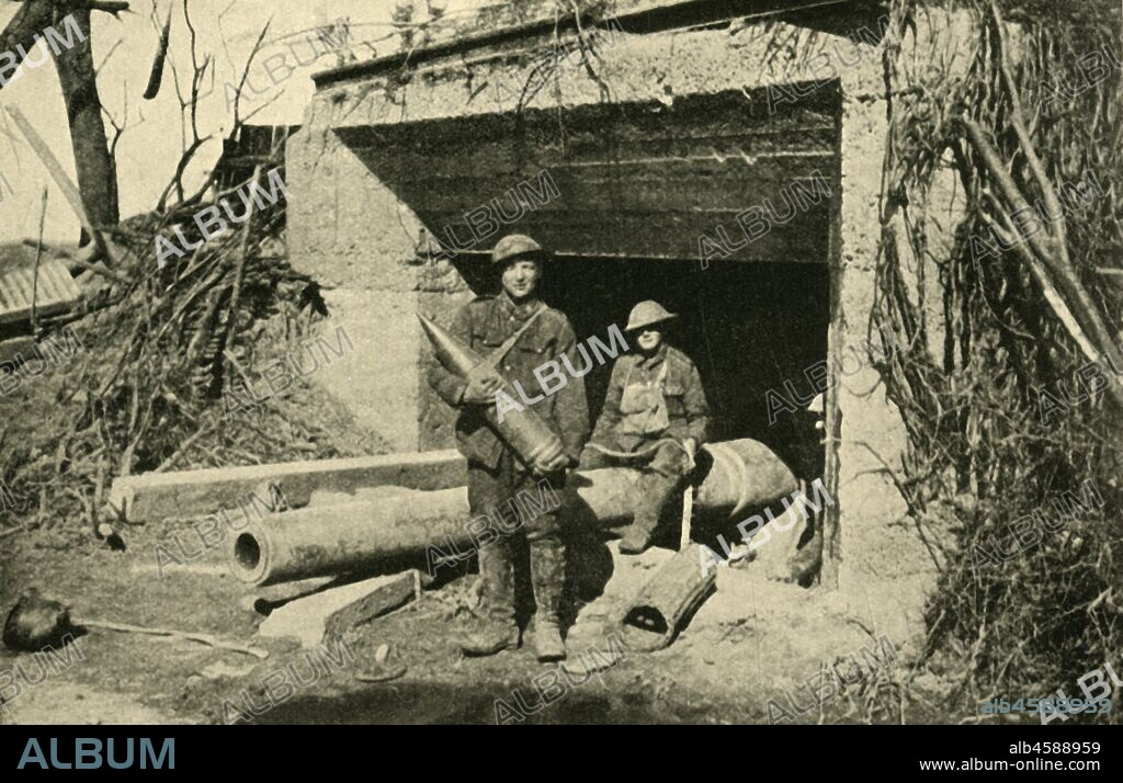 '....a captured 8-inch naval gun in its concrete emplacement', First World War, c1917, (c1920). 'The Hindenburg Defences:', British soldiers on the Western Front in northern France, with heavy artillery and shells won from the Germans under Field Marshal von Hindenburg. From "The Great World War: A History", Volume VII, edited by Frank A Mumby. [The Gresham Publishing Company Ltd, London, c1920].