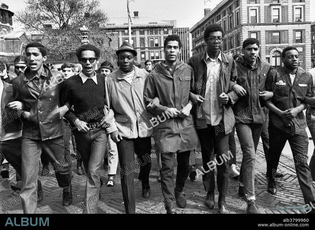 Members of the Student Afro-American Society (SAS), a black militant protest group, demonstrating on the Columbia University campus. On April 23, 1968, Columbia University students began a nonviolent occupation of campus buildings that lasted nearly a week. Students and community supporters called for the university to cut its ties to research for the war in Vietnam and to end construction of a gym in Morningside Park. Several hundred students gathered at the sundial on the Columbia campus led by the Student Afro-American Society (SAS) and Students for a Democratic Society (SDS). Some went to Morningside Park, where they tore down a fence around the gymnasium construction site and battled with police. Then they and other protesters marched into Hamilton Hall, Columbia's main undergraduate classroom building, occupied its lobby, and prevented the dean of the college from leaving his office. By morning, African-American students continued to occupy Hamilton, while other Columbia and Barnard students, mostly white, took over President Grayson Kirk's office in Low Library. After negotiations failed, the administration sent in the police, injuring many and arresting over 700, triggering a campus-wide strike that shut down the university.