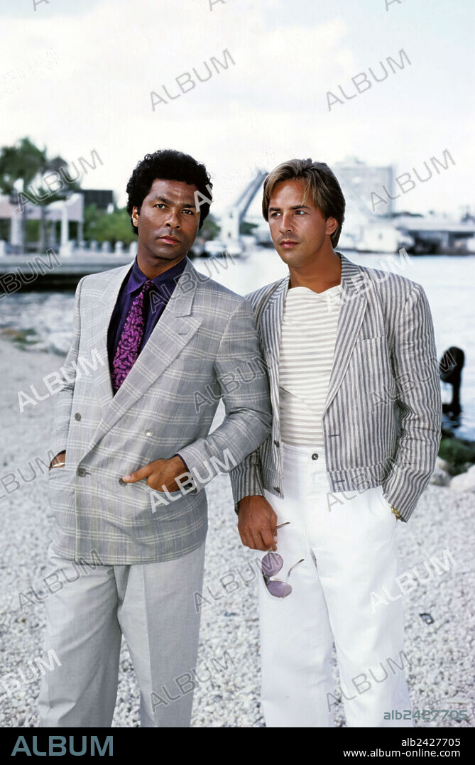 DON JOHNSON and PHILIP MICHAEL THOMAS in MIAMI VICE, 1984, directed by JOHN NICOLELLA, LEON ICHASO and RICHARD COMPTON. Copyright UNIVERSAL TV.