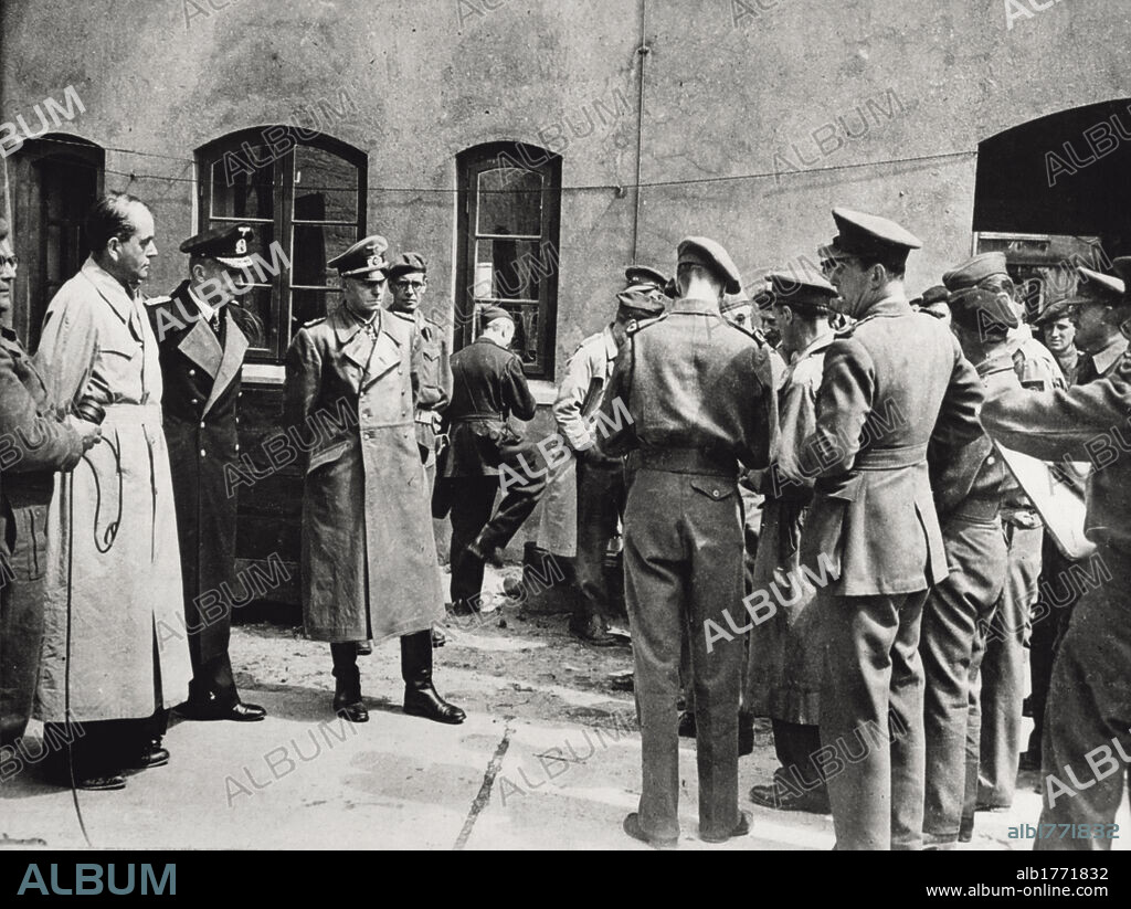 The Nazi leaders Karl Doenitz, Albert Speer and Alfred Jodl after they have been captured. From left, the former ministry Albert Speer, the Reich grand admiral and chancellor Karl Doenitz and the general Alfred Jodl, some minutes after their capture by the British troops. They are now answering to the questions of war correspondents of the allied forces. Flensuburg (Germany), May 23, 1945.
